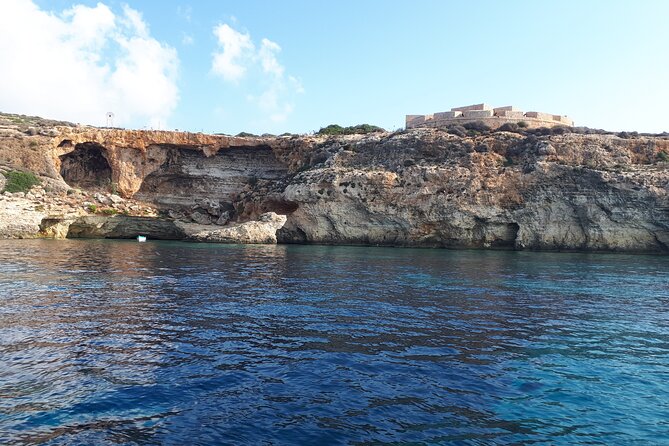 2 hour Private Boat Adventure Tour of Comino and Blue Lagoon - Santa Maria Bay: quiet Comino, boat-only caves, and a history stop
