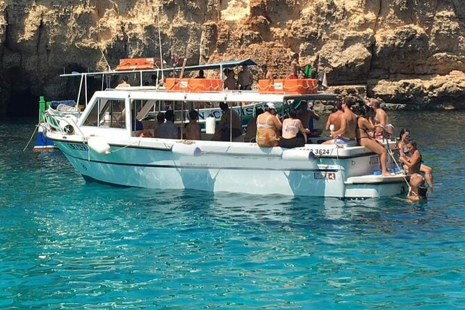 Comino and Gozo Private Boat Tour : Julie Pearl Boat - Stop 2: Crystal Lagoon, caves, and free snorkeling masks