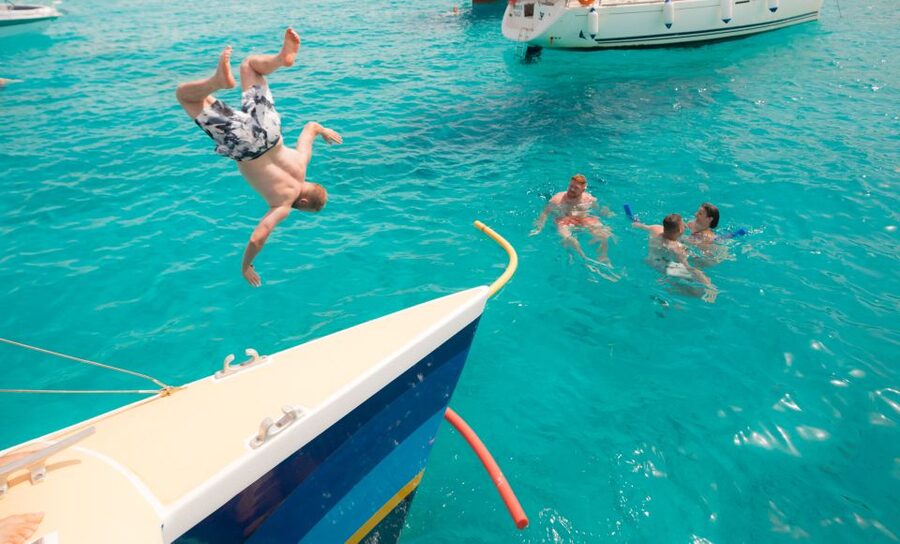 Comino: Blue Lagoon Catamaran Cruise with Lunch and Open Bar - Music, dancing, and choosing your vibe on deck