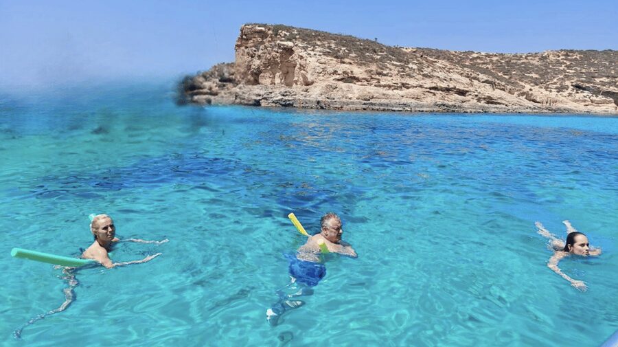 Comino Splash & Dash: Private Blue/Crystal Lagoon Boat Tour - What onboard feels like: shade, sun deck, WiFi, and a Bluetooth speaker