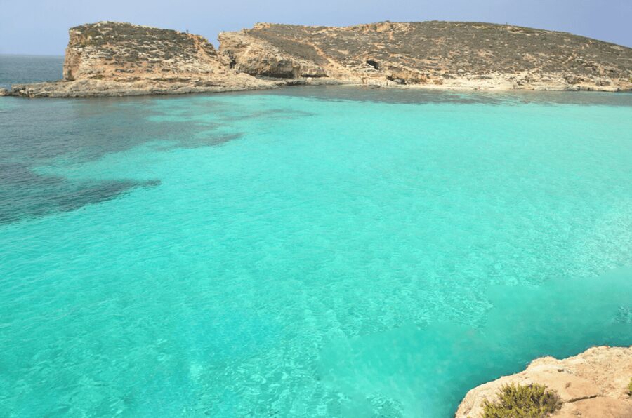 From Malta/Gozo: Comino & Crystal Lagoon Private Boat Trip - Stop 1: Comino Sea Caves and Quick Photo Runs