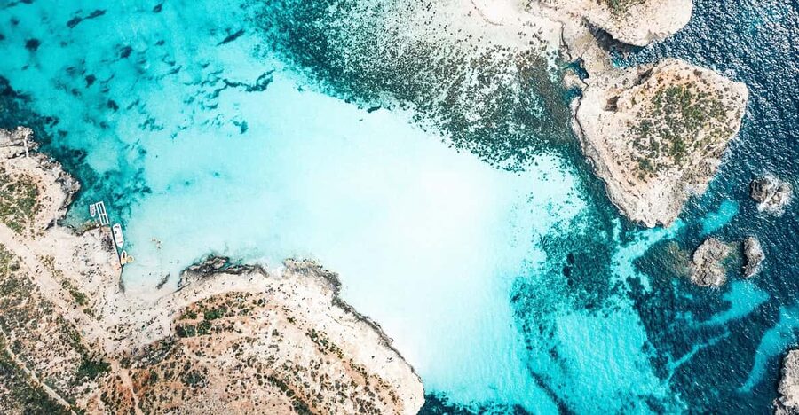 From Mellieha: Three Bay Cruise including the Blue Lagoon - Halfa Rock Bay on Gozo: a pebble beach break when others get busy