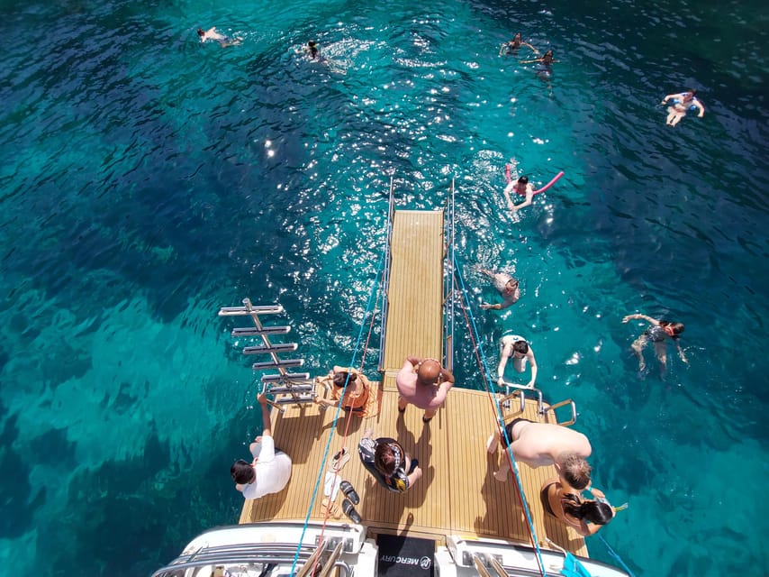 From Mellieha: Three Bay Cruise including the Blue Lagoon - Crystal Lagoon on Comino: sheltered water and sea-cave scenery for about an hour