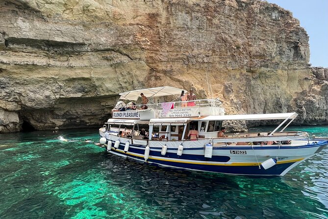 Half day Cruise - Comino, Gozo, Blue & Crystal Lagoon, and Caves - The boat setup: comfortable sun deck, simple facilities, and a ladder to the top