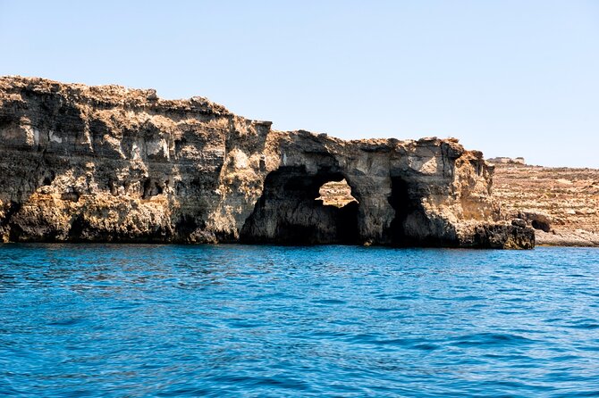 Half day Cruise - Comino, Gozo, Blue & Crystal Lagoon, and Caves - Stop 1: Blue Lagoon swimming, snorkel, and the busiest-water reality