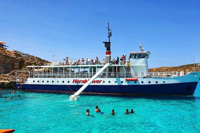 Malta: Comino, Blue Lagoon & Caves - swim, snorkel & slide - Onboard food, drinks, and the slide: practical fun without planning
