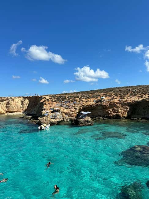 Malta: Gozo, Comino, Blue & Crystal Lagoon, & Caves Cruise - Crystal Lagoon, Xlendi Bay, and Saint Mary’s Tower on the return