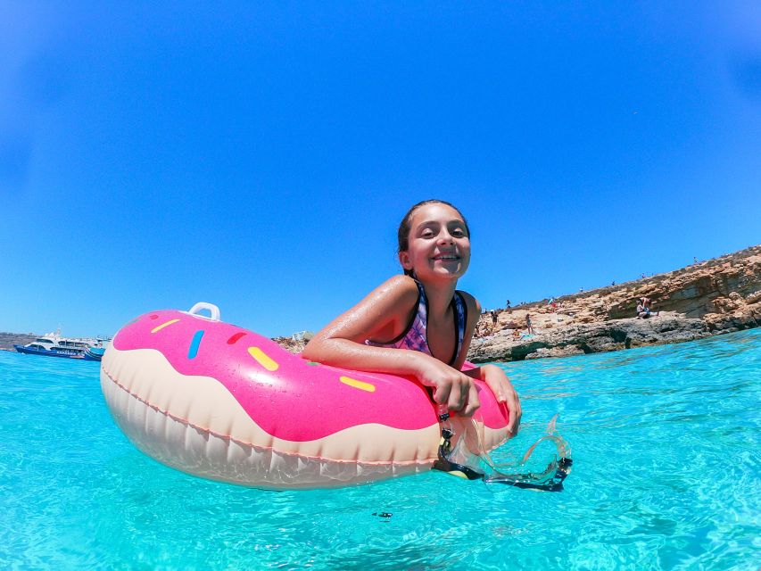Malta: Sunset Cruise to the Blue Lagoon - Onboard comforts: deck chairs, slides, bar vibes, and onboard music
