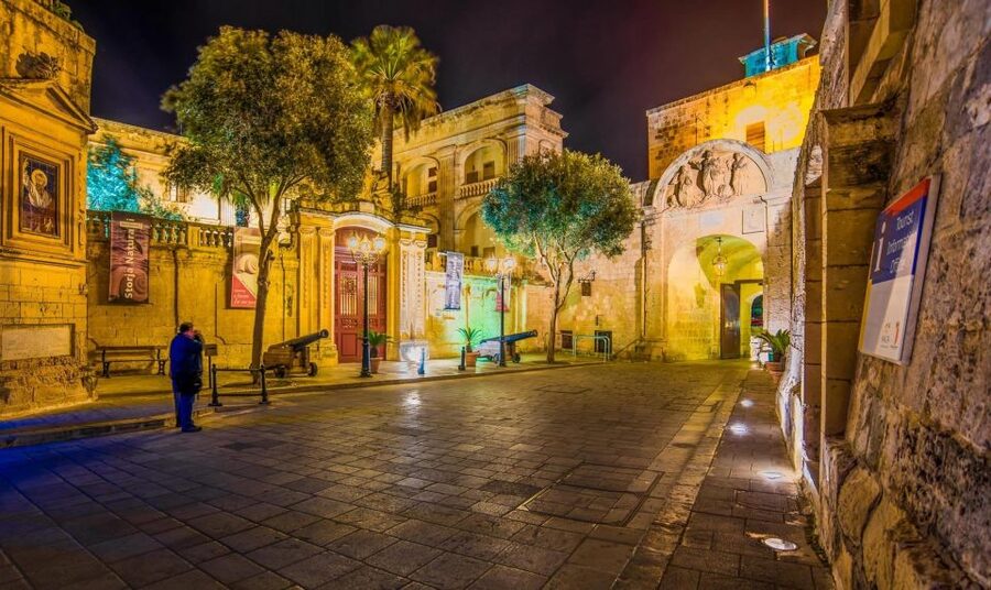 Mdina: Valletta Waterfront Area, Mdina, and Rabat Night Tour - The Valletta Waterfront promenade and its color-coded warehouse doors