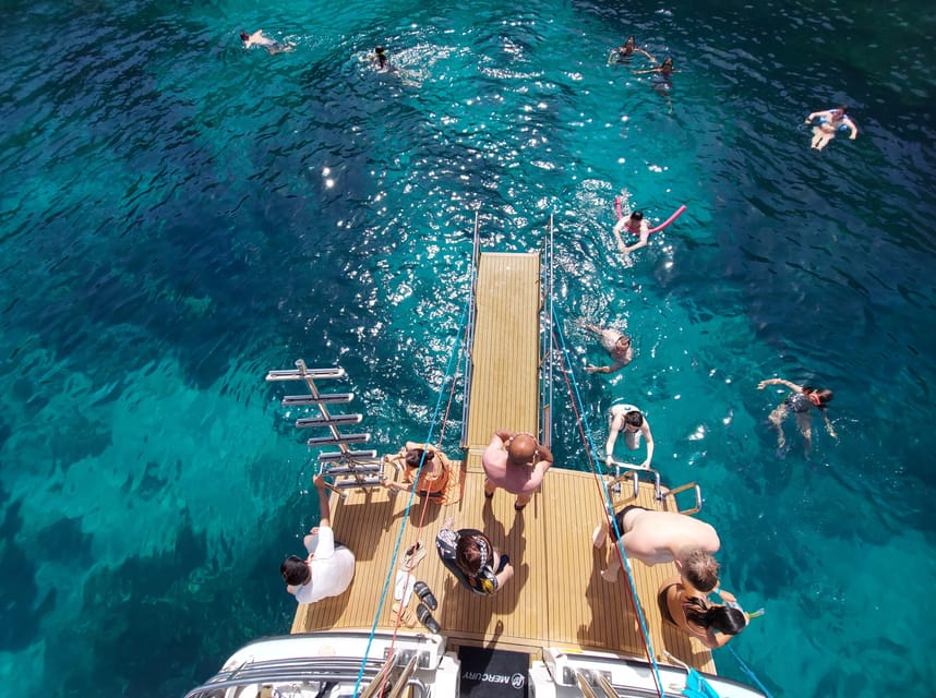 Mellieha: Two Bay Evening Cruise Including The Blue Lagoon - The Blue Lagoon Hour: Swimming, Snorkeling, and the Access Pass Rule