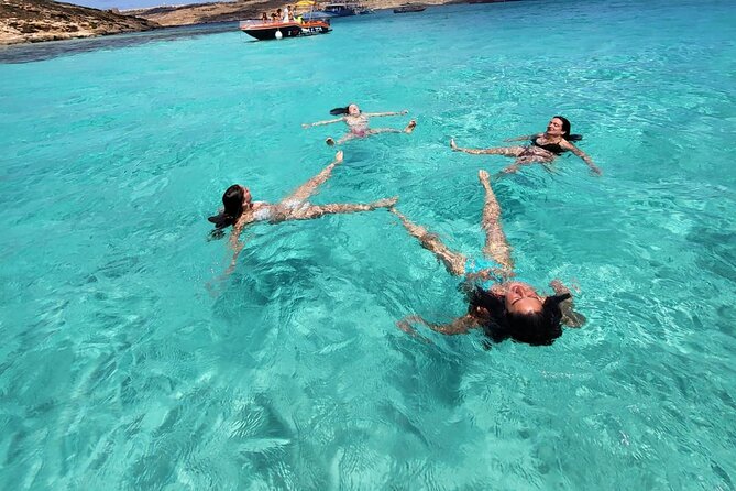 Private Boat Tour at Comino's Blue Lagoon and Crystal Lagoon - Comino’s High Cliffs and Cave Passages: For When You Want Scenery Too