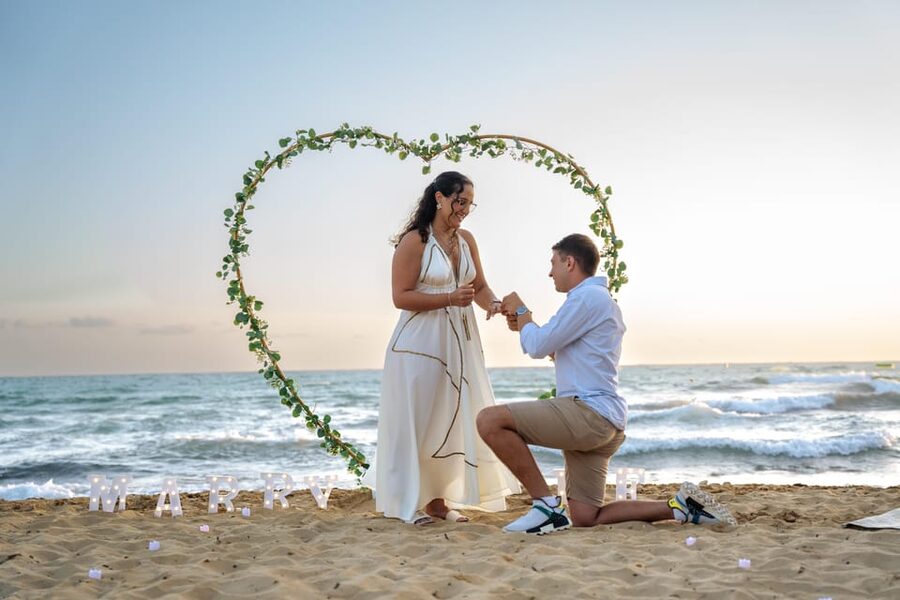 Proposal Photoshoot with Professional Photographer in Malta - Picking your Malta look: beach arch lights vs sunset picnic fairy lights