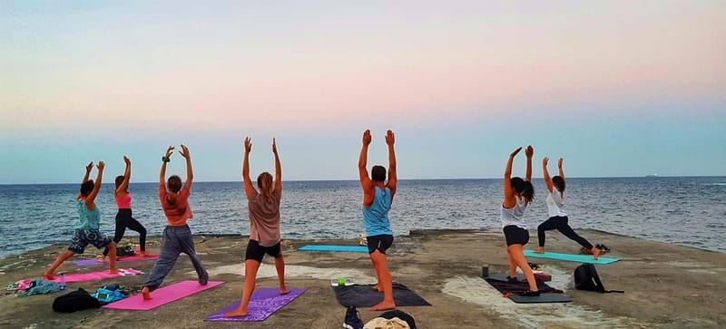 Sliema: Beach Yoga Class with Swimming - Sliema’s beach yoga is about timing and air