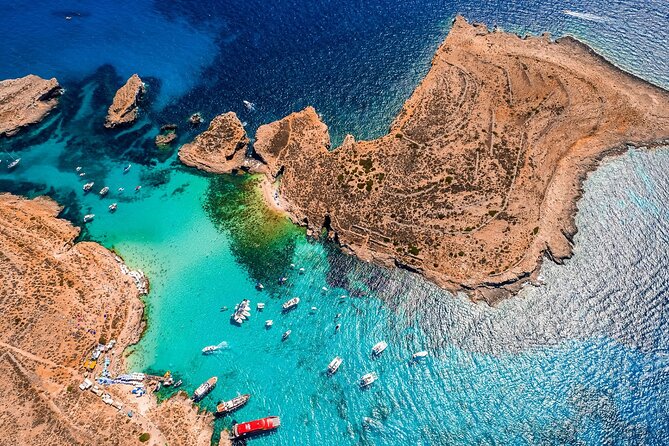 Three Bay Cruise Including Blue Lagoon from Mellieha - Onboard comfort: toilets, shower, and a small cash bar
